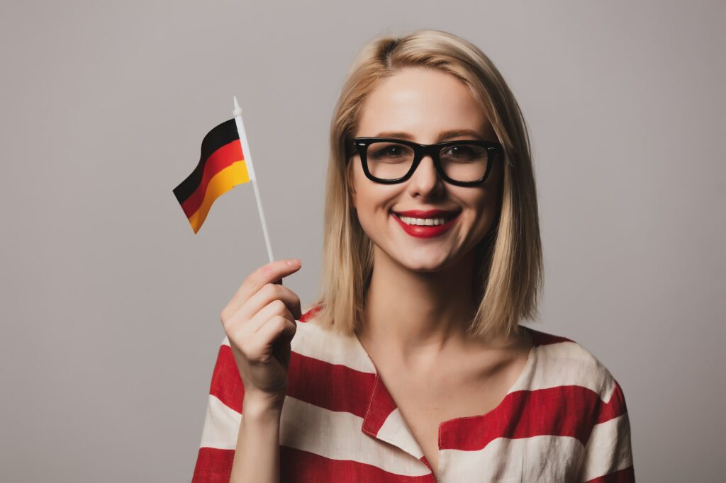 beatiful girl holds German flag
